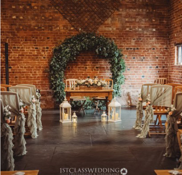 Wedding venue styled with elegant table décor, floral arrangements and coordinated reception details by The Wedding House Worcestershire
