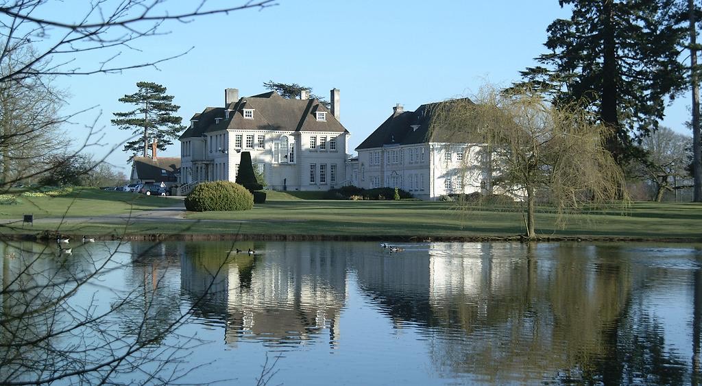 Brockencote Hall wedding venue in Worcestershire with lake, landscaped grounds and luxury country house exterior