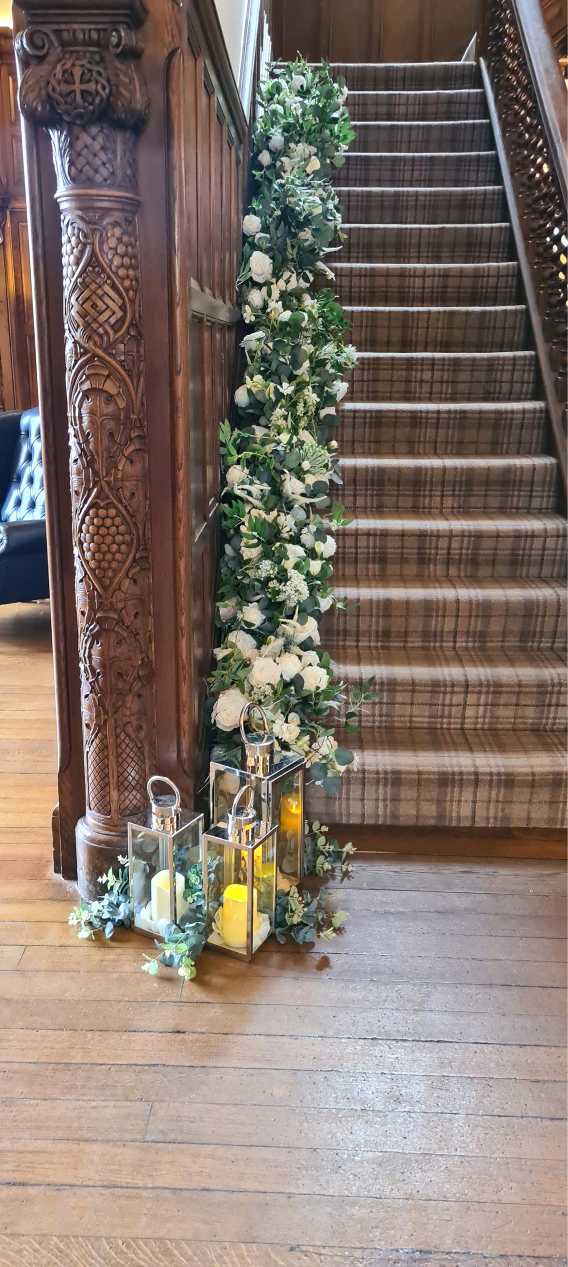 Floral staircase garland with white roses and eucalyptus at Pendrell Hall wedding venue West Midlands