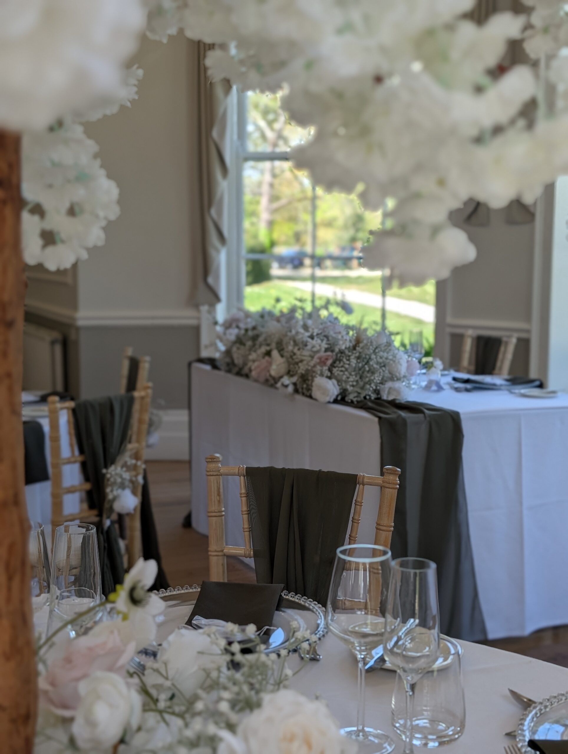 top table wedding decor hire Eastington Park olive chair drapes silver charger plates floral runner Worcestershire