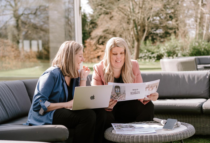 Wedding content creator filming behind-the-scenes moments and capturing social media ready footage on a wedding day