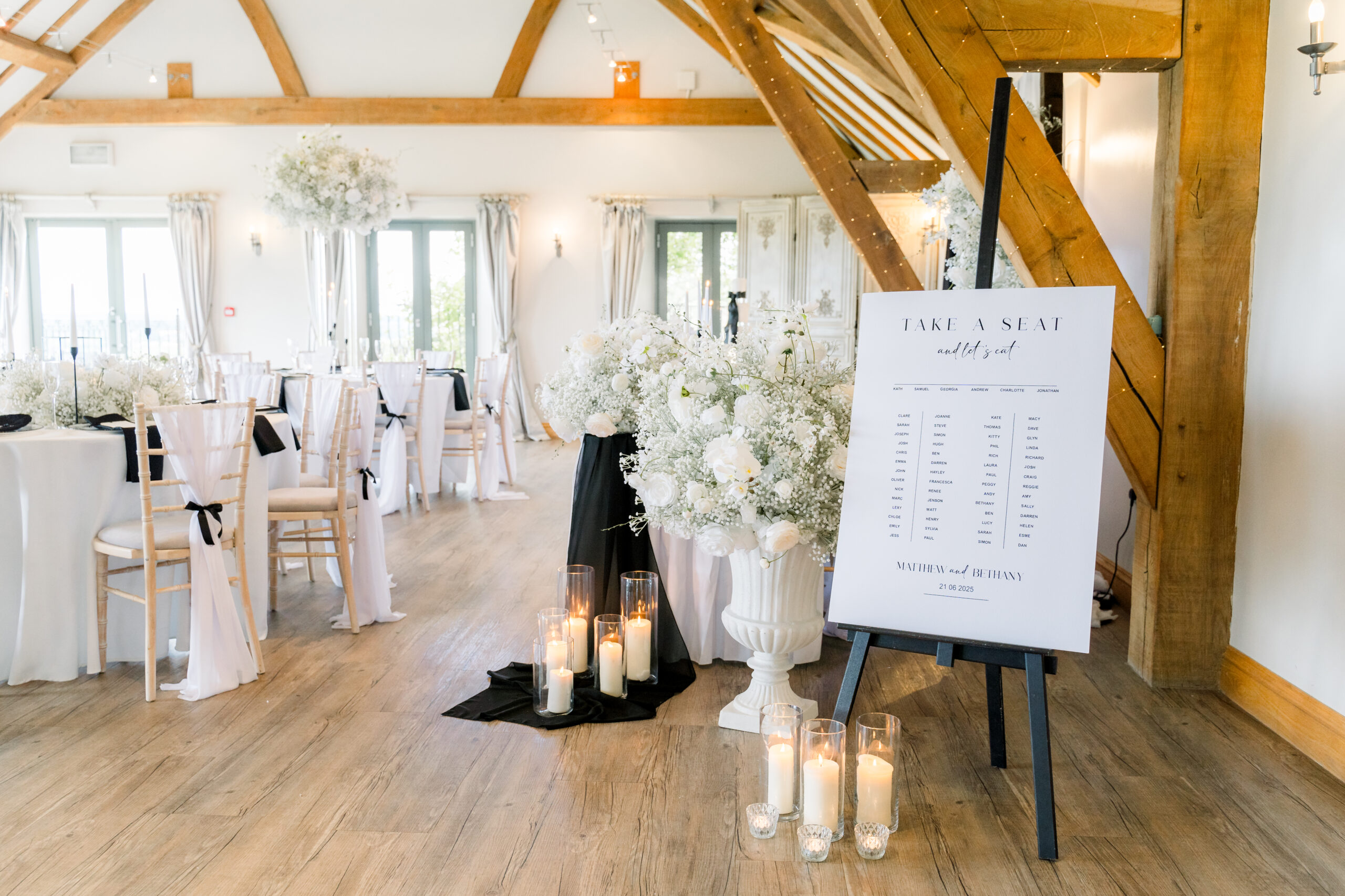 Wedding venue styling with floral décor and coordinated ceremony setup by The Wedding House in Worcestershire